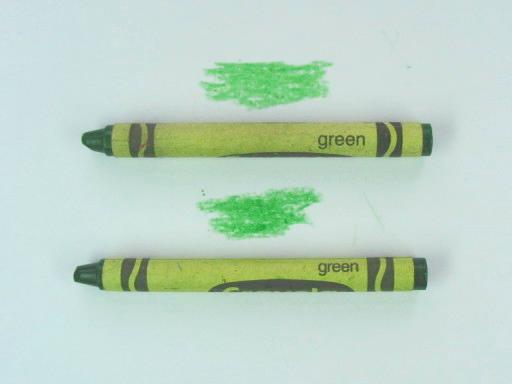 two green crayons and their marks